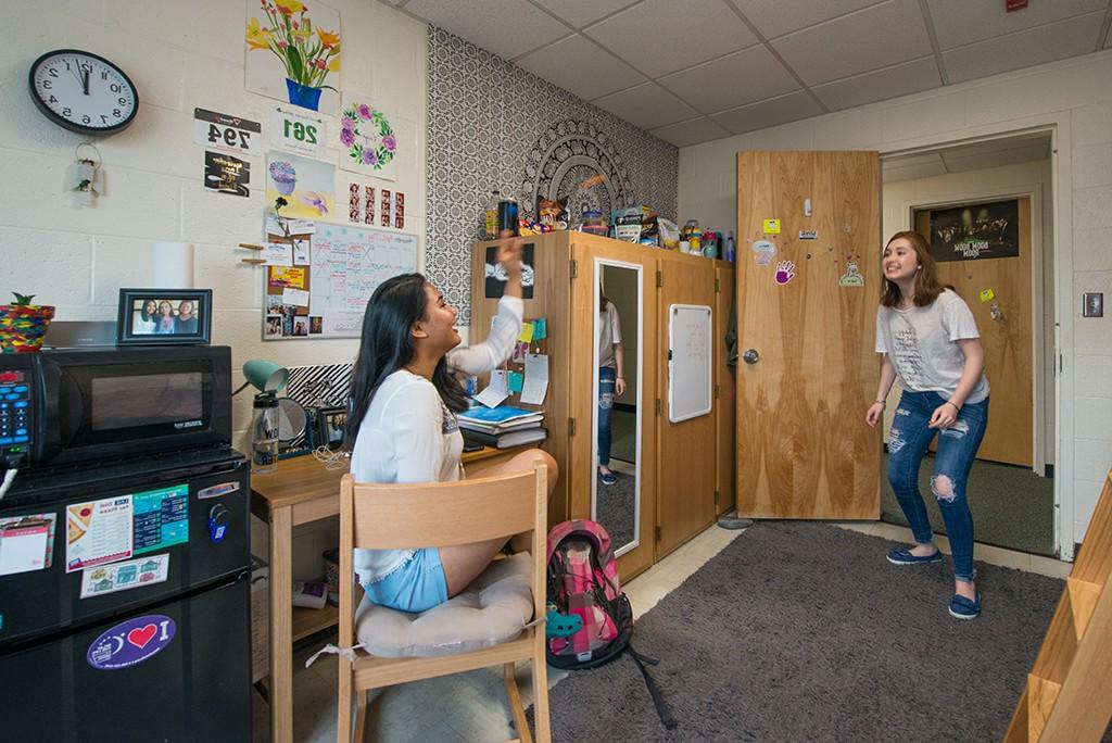 Two U N E students in a dorm room